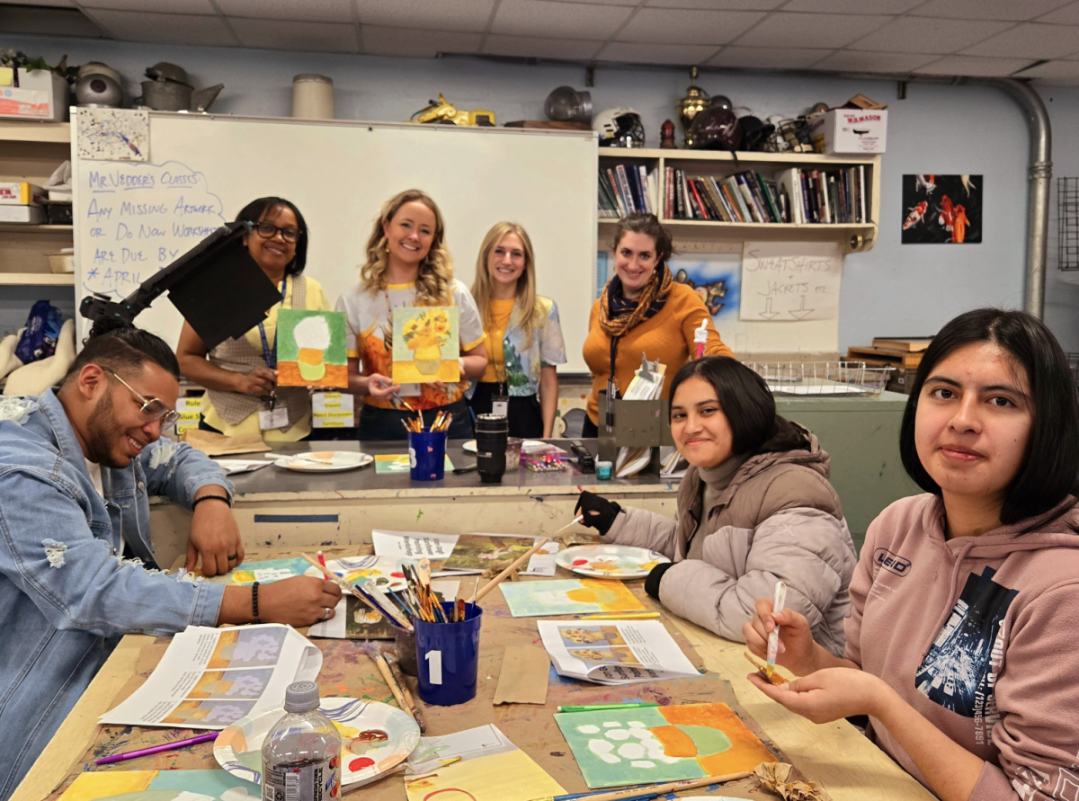 Students and teachers paint pictures celebrating artist Vincent Van Gogh during Art Week. (Photo source: Dr. Marino)